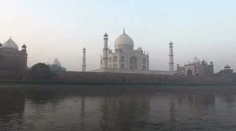 India Taj Mahal complex at dawn from the river Stock Footage 24651514