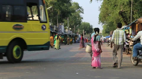 India Tamil Nadu Chettinad woman in magenta with bucket 4 Stock Footage 23957504