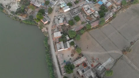 India, A top angle drone aerial shot during sunrise of an Indian village Stock Footage 109243233