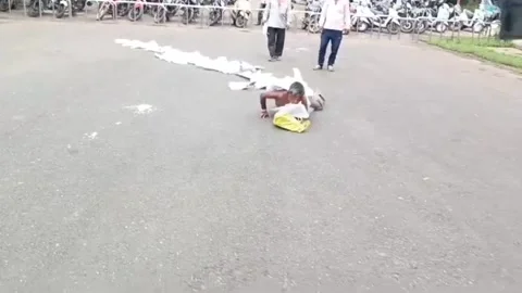 India: Unique protest! Man wraps himself in chain of complaints at collector... Stock Footage 283557625