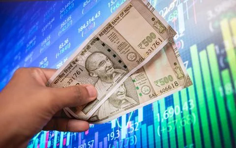 Indian 500 rupee banknotes placed on Indian flag Background 写真素材