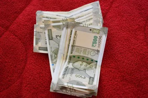 Indian 500 Rupees notes on red background Stock Photos