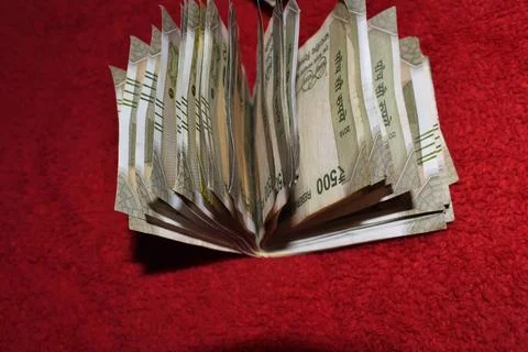 Indian 500 Rupees notes on red background Stock Photos