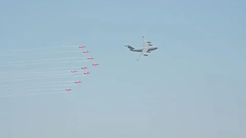 Indian Air Force aerobatic display team flying in formation with C17 Globemaster Stock Footage 233075888