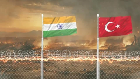 Indian and Turkish flags waving on wire fence with fiery war zone backgroun.. Vídeos de archivo 341618454