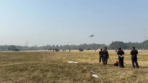 Indian army professionals on maidan practising for Republic Day with choppers Stock Footage 300533090