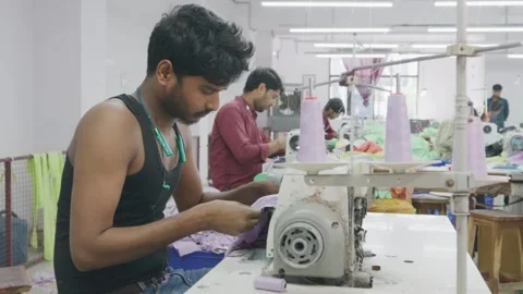 Indian Artisan or a tailor man working on a specialized Fabric textile machine Stock Footage 243638529