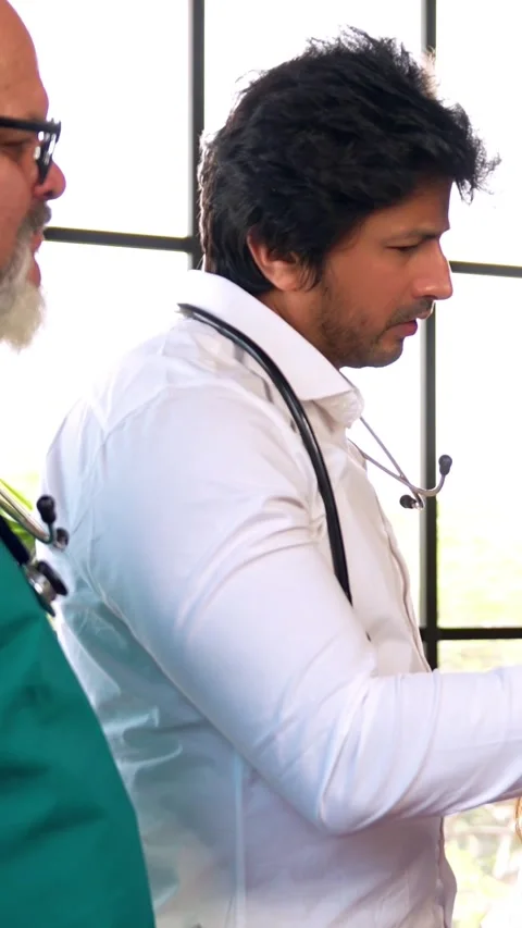 Indian Asian group of professional doctors surgeons collaborating and discussing Stock Footage 342574017
