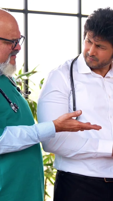 Indian Asian group of professional doctors surgeons collaborating and discussing Stock Footage 342574027