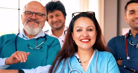 Indian Asian group of professional doctors surgeons collaborating and discussing Stock Footage 342574399