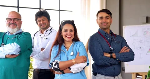 Indian Asian group of professional doctors surgeons collaborating and discussing Stock Footage 342574429