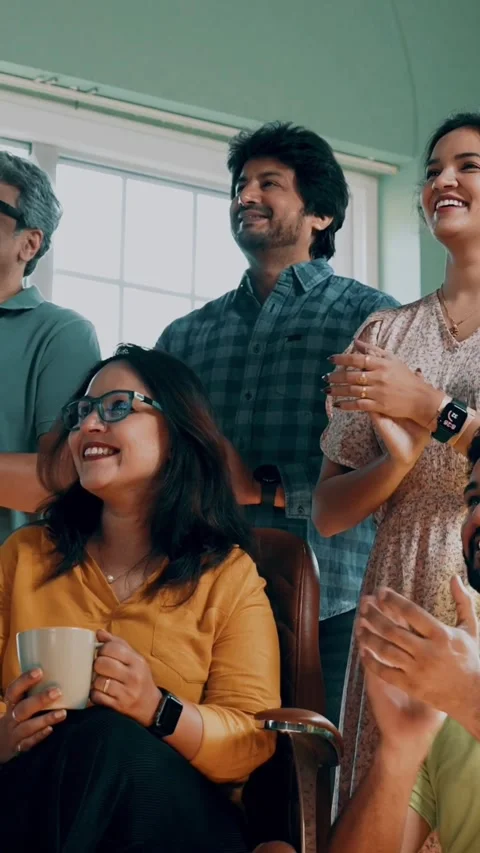 Indian Asian startup team clapping, looking up, celebrating success Stockbeeldmateriaal 342507242