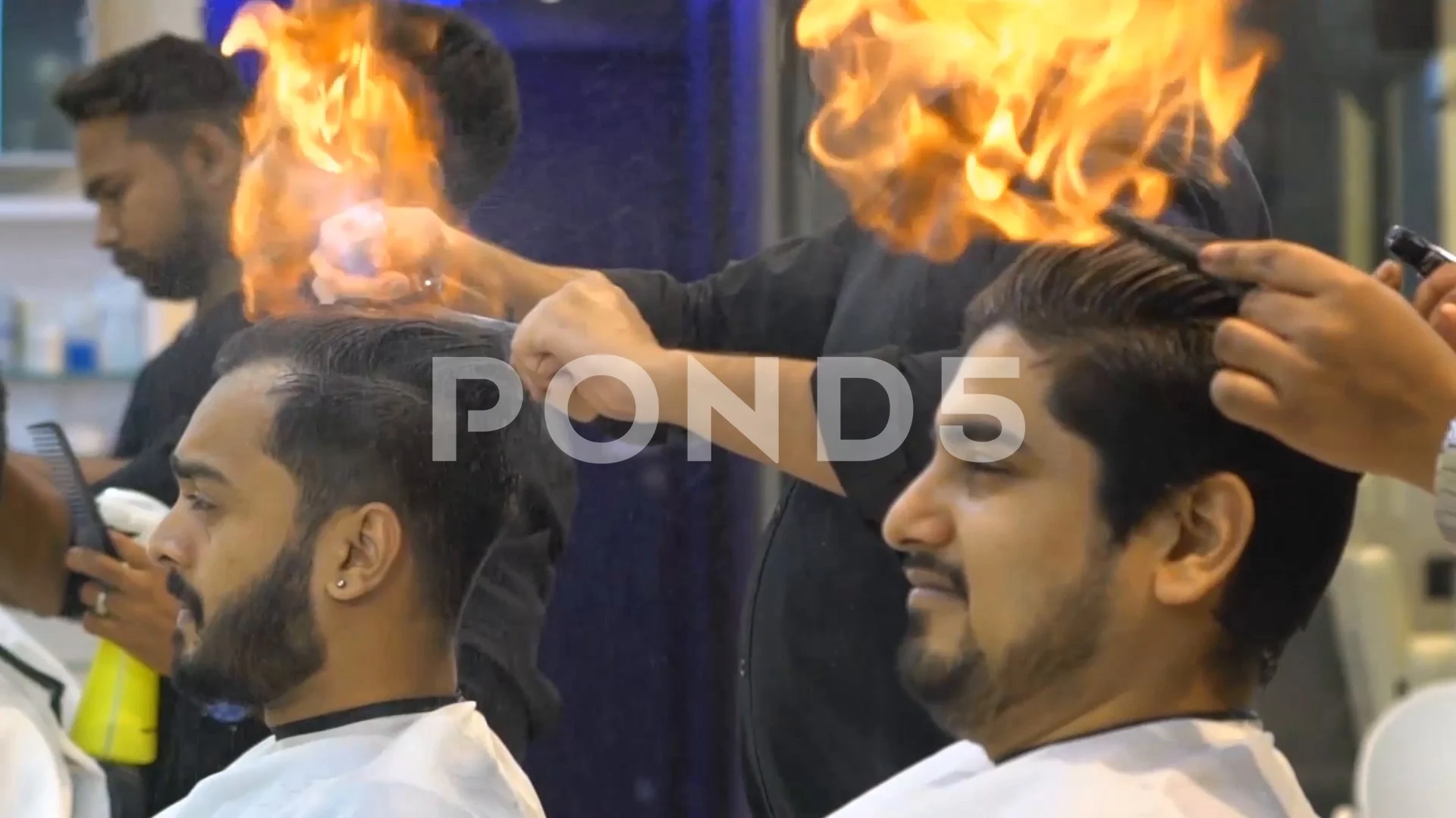 Indian barber cuts men hair by setting i... | Stock Video | Pond5