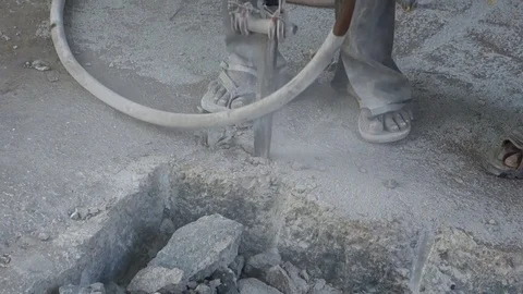 Indian blue-collar worker using Pneumatic hammer city road Stock Footage 74413904