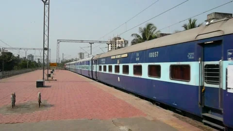 Indian Blue Express Train Speed Crossing Dahisar Railway station Mumbai India Stock Footage 153162539