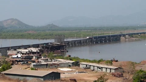 Indian Blue Passenger Express Train Crossing Railway River bridge Mumbai India Stock Footage 136112160