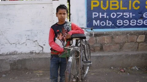 Indian boy with bicycle Stock Footage 62516397