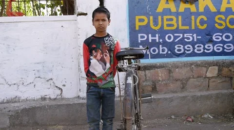 Indian boy with bicycle Stock Footage 62529084