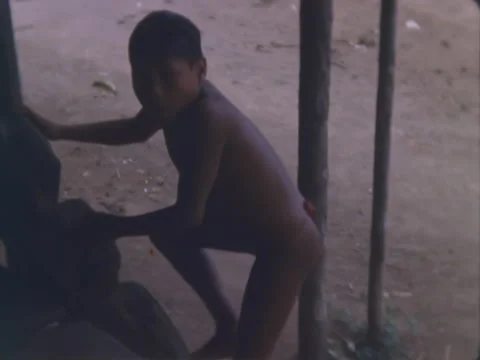 Indian boy climbs steps to his home in jungle of Panama. Stock Footage 148126504