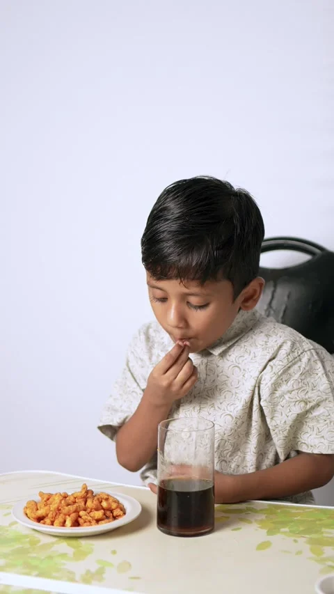 Indian Boy Eating Crispy Snacks Stock Footage 341323107