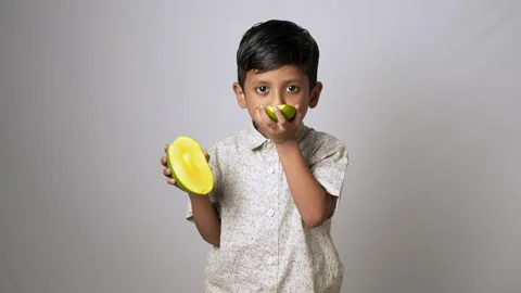 Indian Boy Eating Fresh Mango Slices Stock Footage 341248073