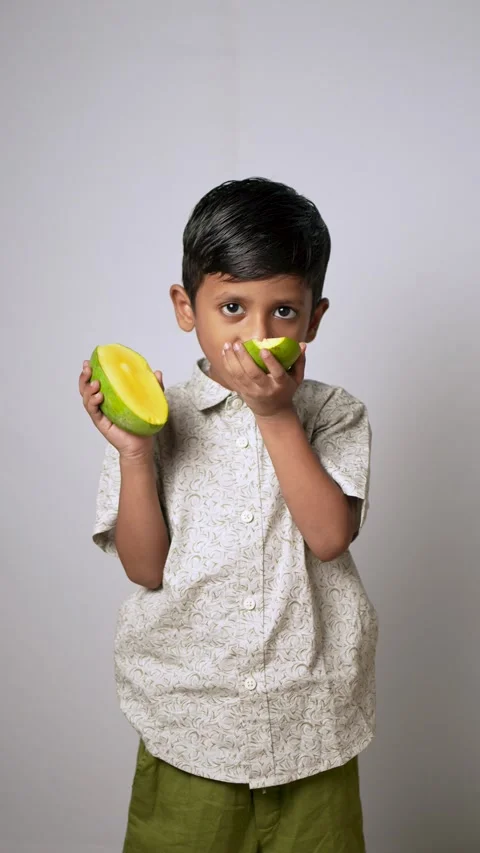 Indian Boy Eating Fresh Mango Slices Stock Footage 341322112
