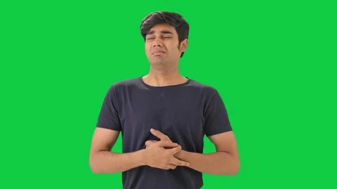 Indian boy having acidity and gastric problem Green screen Stock Footage 244139233