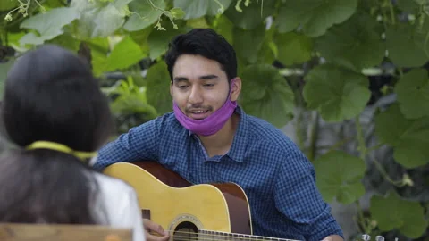 Indian boy playing guitar Stock Footage 134690516