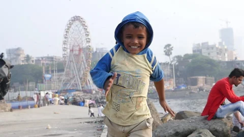 Indian boy running towards the camera, Mumbai, India Stock Footage 139403266