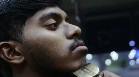 Indian boy shving his first beard Stock Footage 60000606