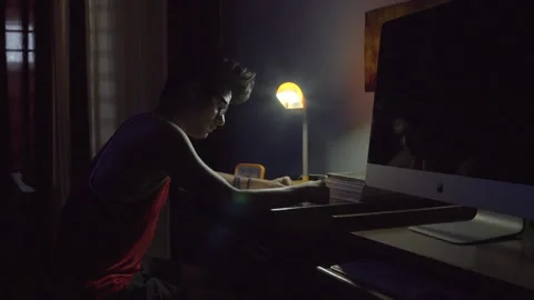 Indian boy studying in the light of Night lamp. 스톡 동영상 144728509