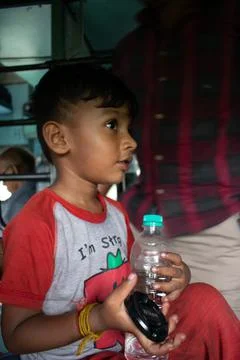 An Indian boy in train. Stock Photos