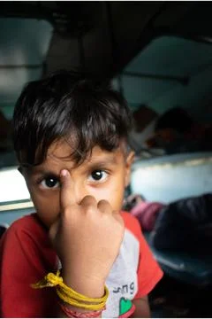 An Indian boy in train. Stock Photos