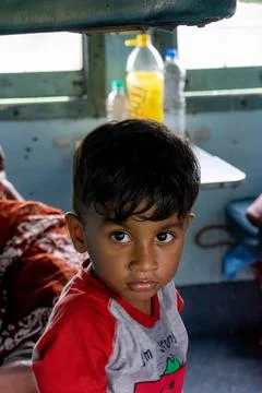 An Indian boy in train. Stock Photos