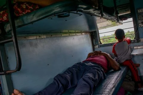 An Indian boy in train. Stock Photos