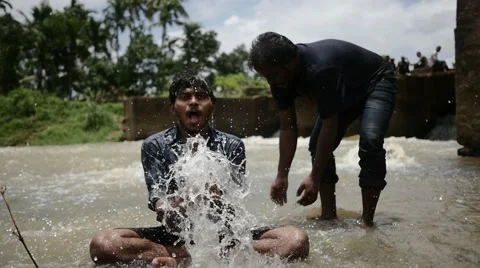 Indian boys playing with river Stock Footage 59824449