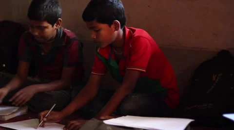 Indian boys practice drawing pan and tilt left to right Stock Footage 49908418