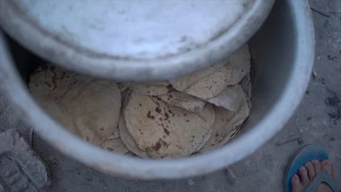 Indian bread known as Chapati or Roti kept in big container. Stock Footage 171958444