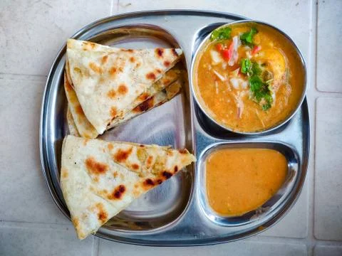 Indian bread served with egg curry Stock Photos