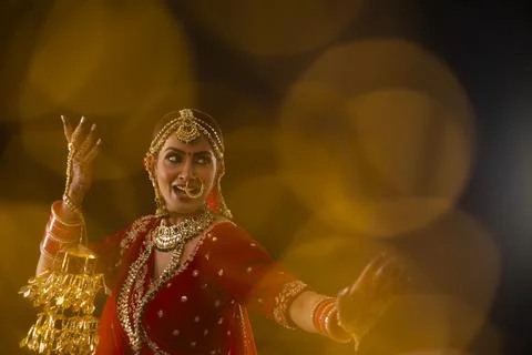 Indian bride dancing at her wedding	 Stock Photos