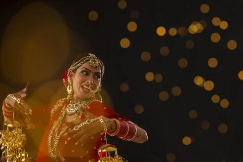 Indian bride dancing at her wedding	 Stock Photos