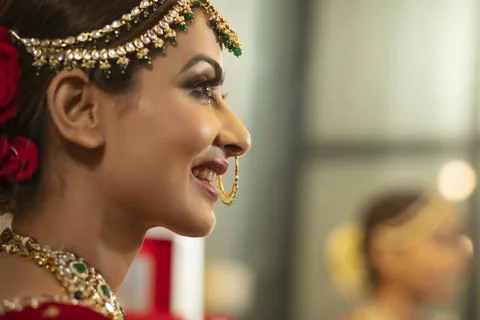 Indian bride during the makeup session Stock Photos