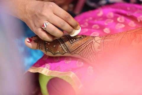 Indian bride getting henna also known as Mehendi or mehndi done. Stock Photos