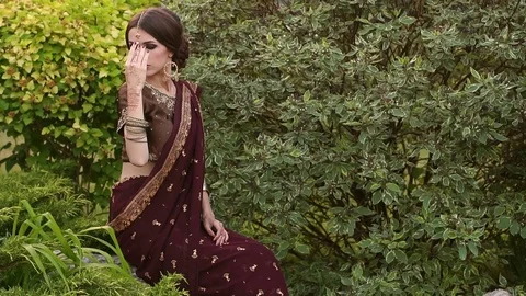 Indian bride in traditional costume and mehendi. Stock Footage