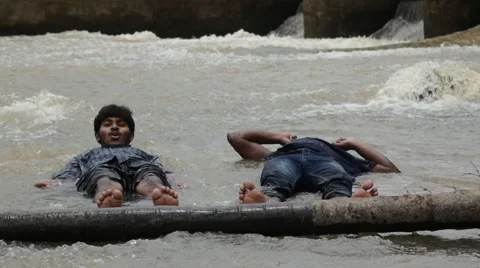 Indian buddies lying in river together Video stock 59823861