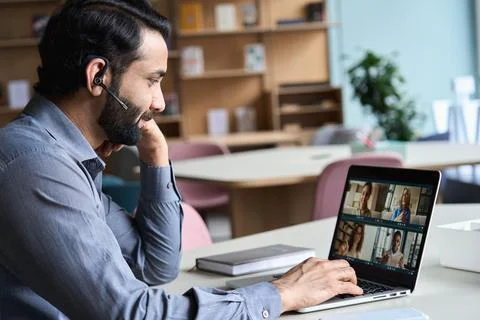 Indian business man having virtual team meeting on video conference call. Stock Photos