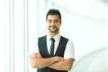 The indian businessman stand by business center Photo