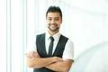 The indian businessman stand by business center Photo