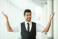 The indian businessman stand by business center and hands up Photo