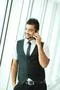 The indian businessman stand by business center stairs, phone and talk Photo